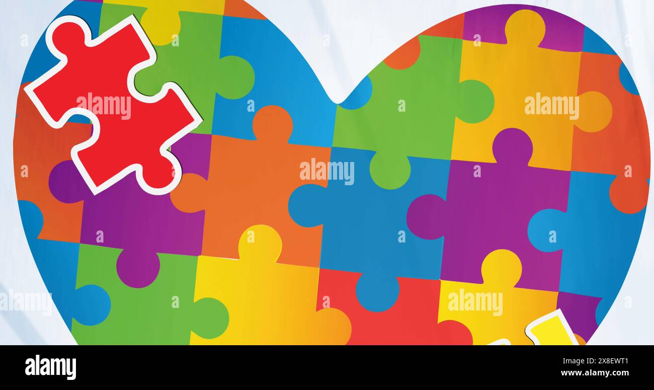 Image of heart of puzzle over puzzle Stock Photo
