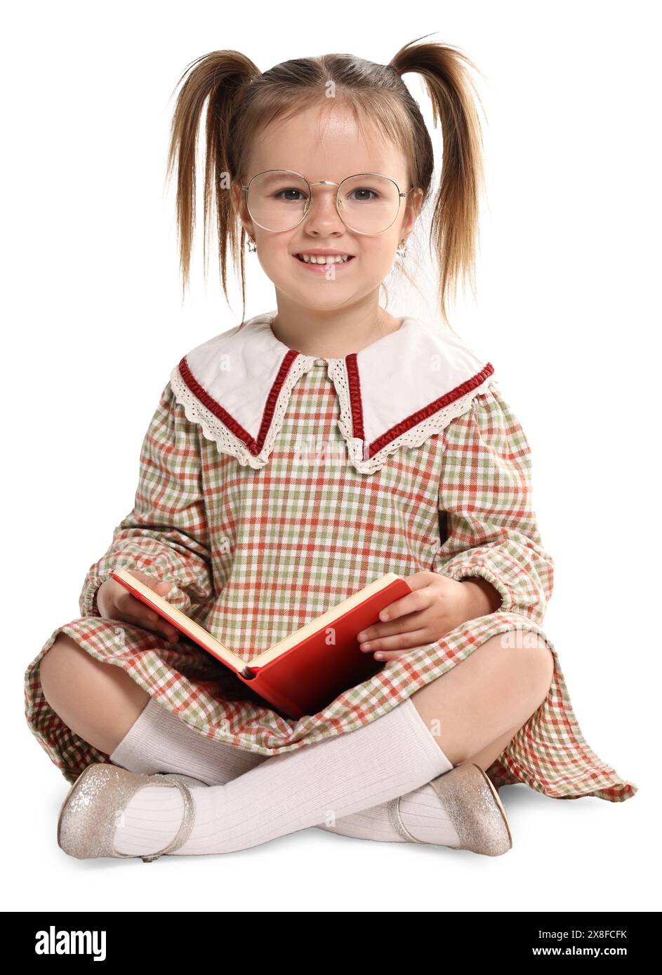 Cute little girl with book on white background Stock Photo - Alamy