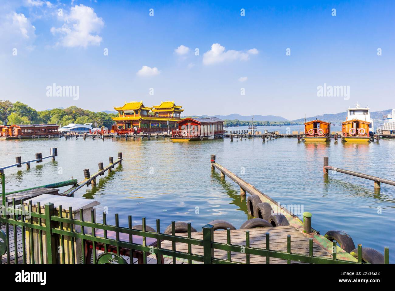 Cruise boats in traditional chinese style at the jetty in Hangzhou, China Stock Photo