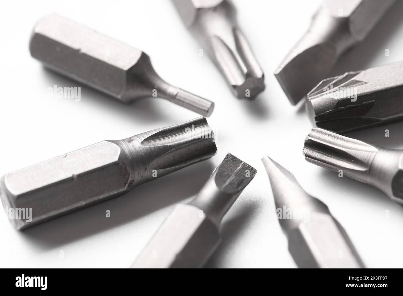 Different screwdriver bits on white background, closeup Stock Photo