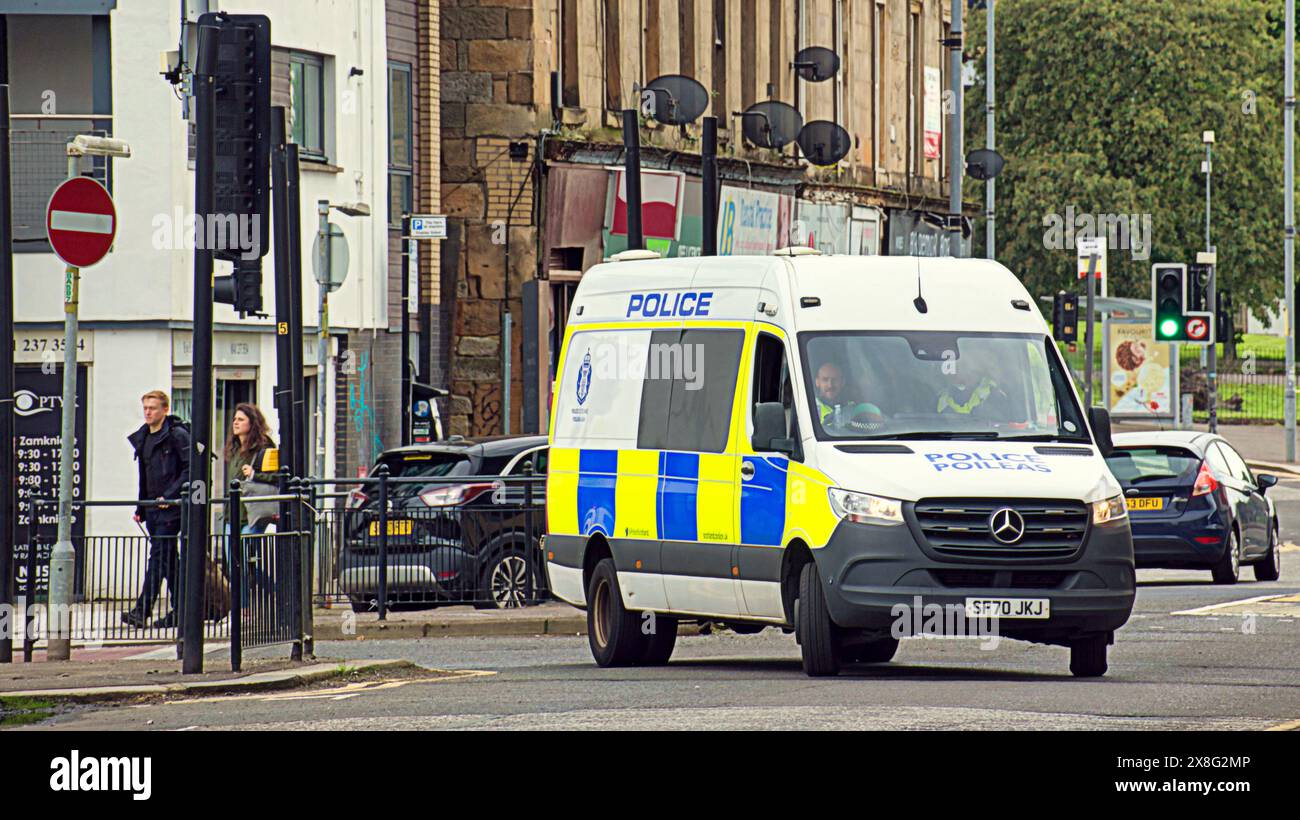 Glasgow, Scotland, UK. 25th May, 2024: Heavy police presence for cup final fans as celtic fans gather for a march from glasgow green to the game there is a heavy police presence around glasgow cross and the merchant city due to last weeks celebrations. Credit Gerard Ferry /Alamy Live News Stock Photo
