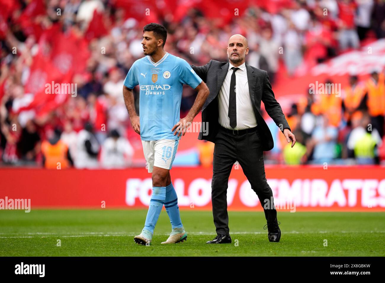 Manchester city manager pep guardiola (right) and manchester city's