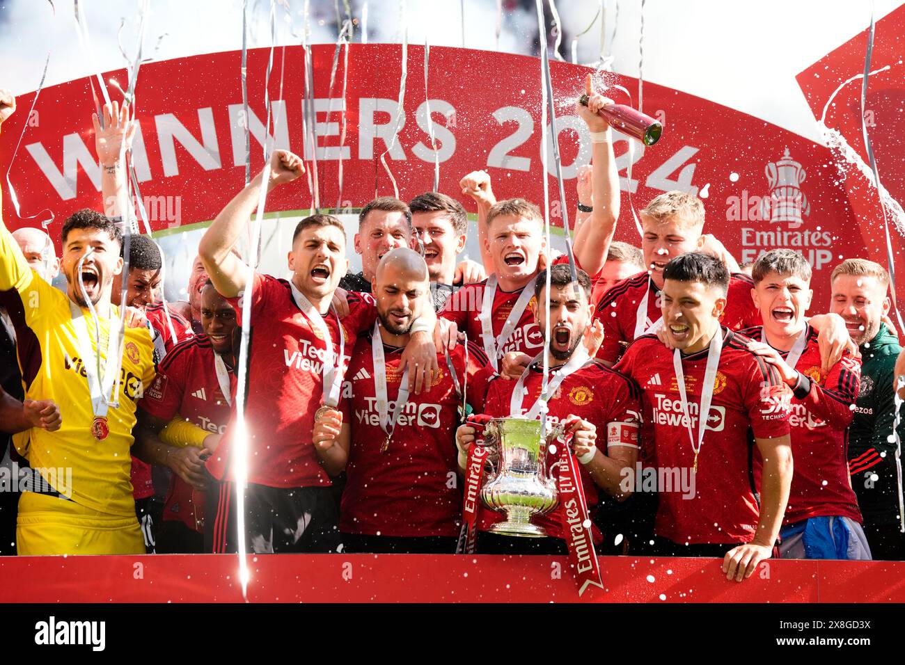 Manchester United's Bruno Fernandes lifts the trophy with teammates after winning the Emirates FA Cup final at Wembley Stadium, London. Picture date: Saturday May 25, 2024. Stock Photo