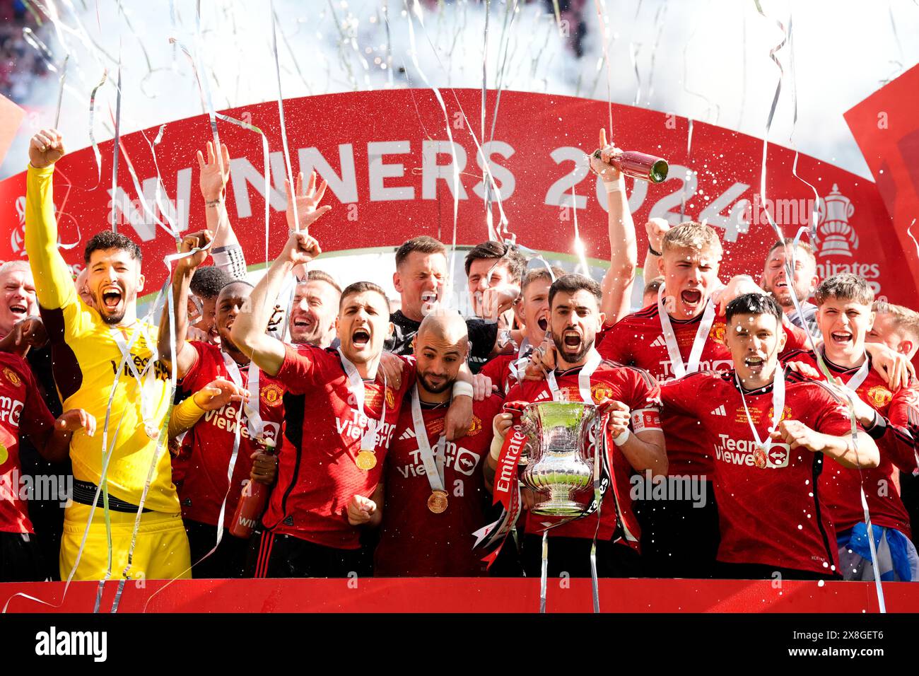 Manchester United's Bruno Fernandes celebrates with the FA Cup Trophy after winning the Emirates FA Cup final at Wembley Stadium, London. Picture date: Saturday May 25, 2024. Stock Photo