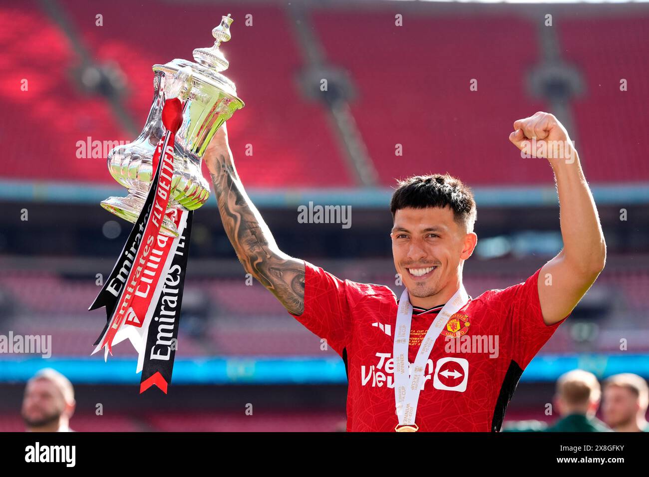 Manchester United s Lisandro Martinez Celebrates With The FA Cup Trophy manchester-united-s-lisandro-martinez-celebrates-with-the-fa-cup-trophy