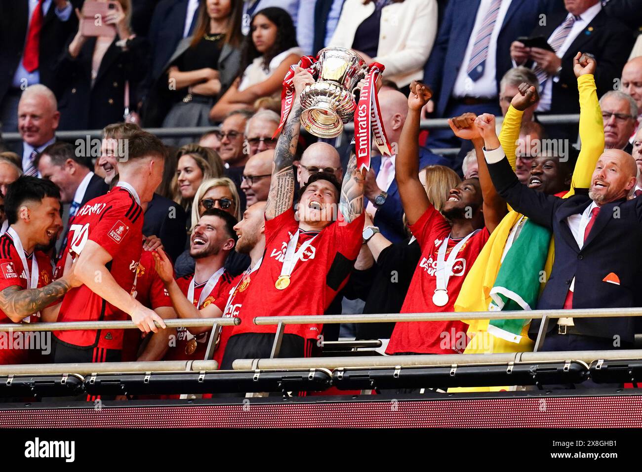 Manchester united's victor lindelof lifts the fa cup trophy after