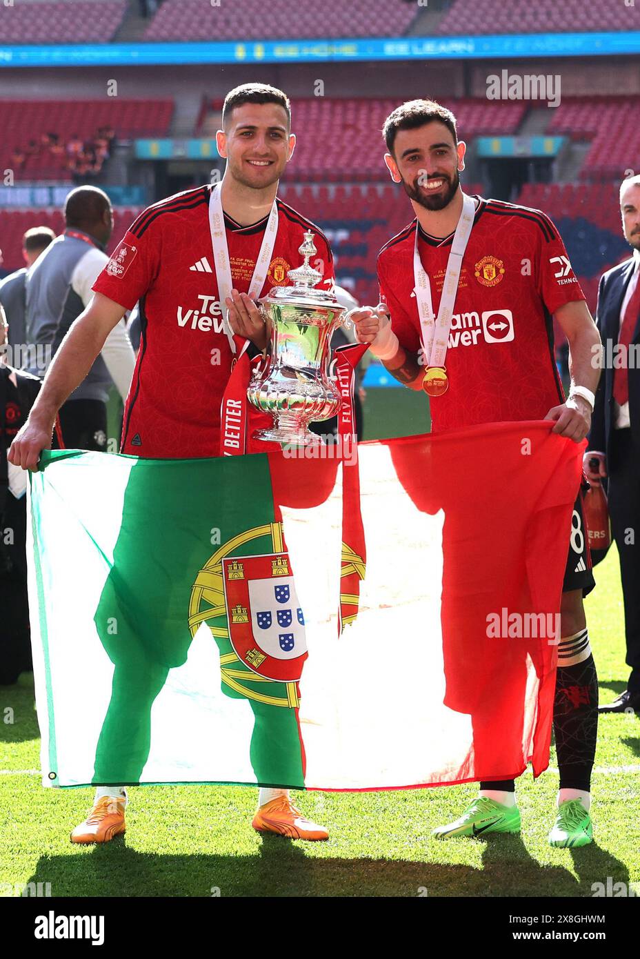 London, UK. 25th May, 2024. Diogo Dalot of Manchester United and Bruno Fernandes of Manchester United with the trophy during the The FA Cup match at Wembley Stadium, London. Picture credit should read: David Klein/Sportimage Credit: Sportimage Ltd/Alamy Live News Stock Photo