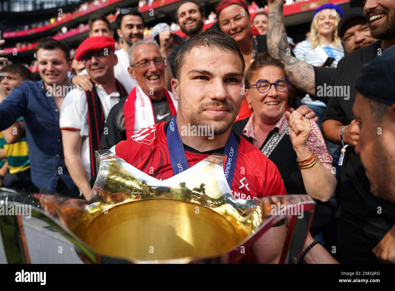 Stade Toulousain's Antoine Dupont with the trophy following the