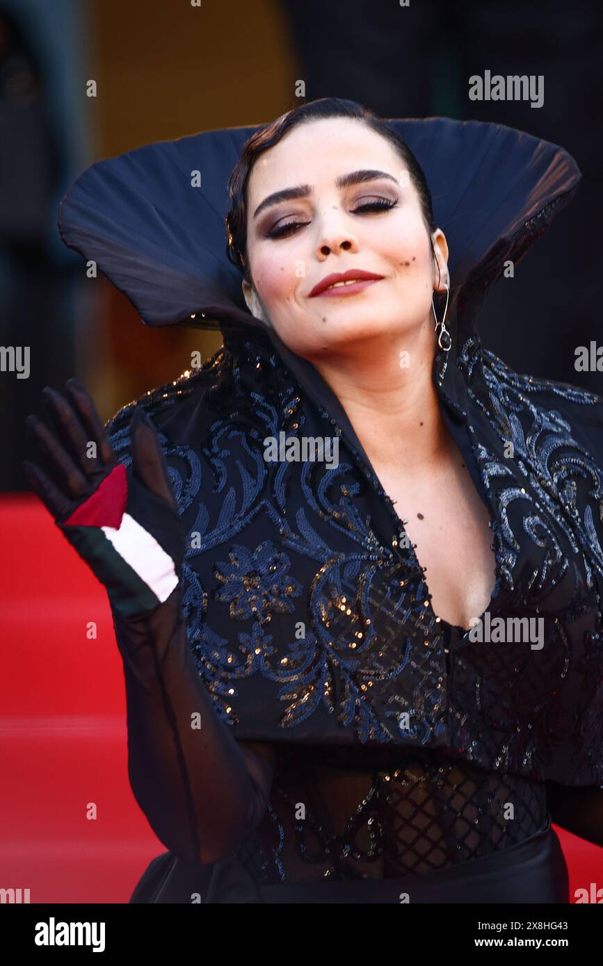 Cannes, France. 25th May, 2024. Asmae El Moudir, wearing a glove with