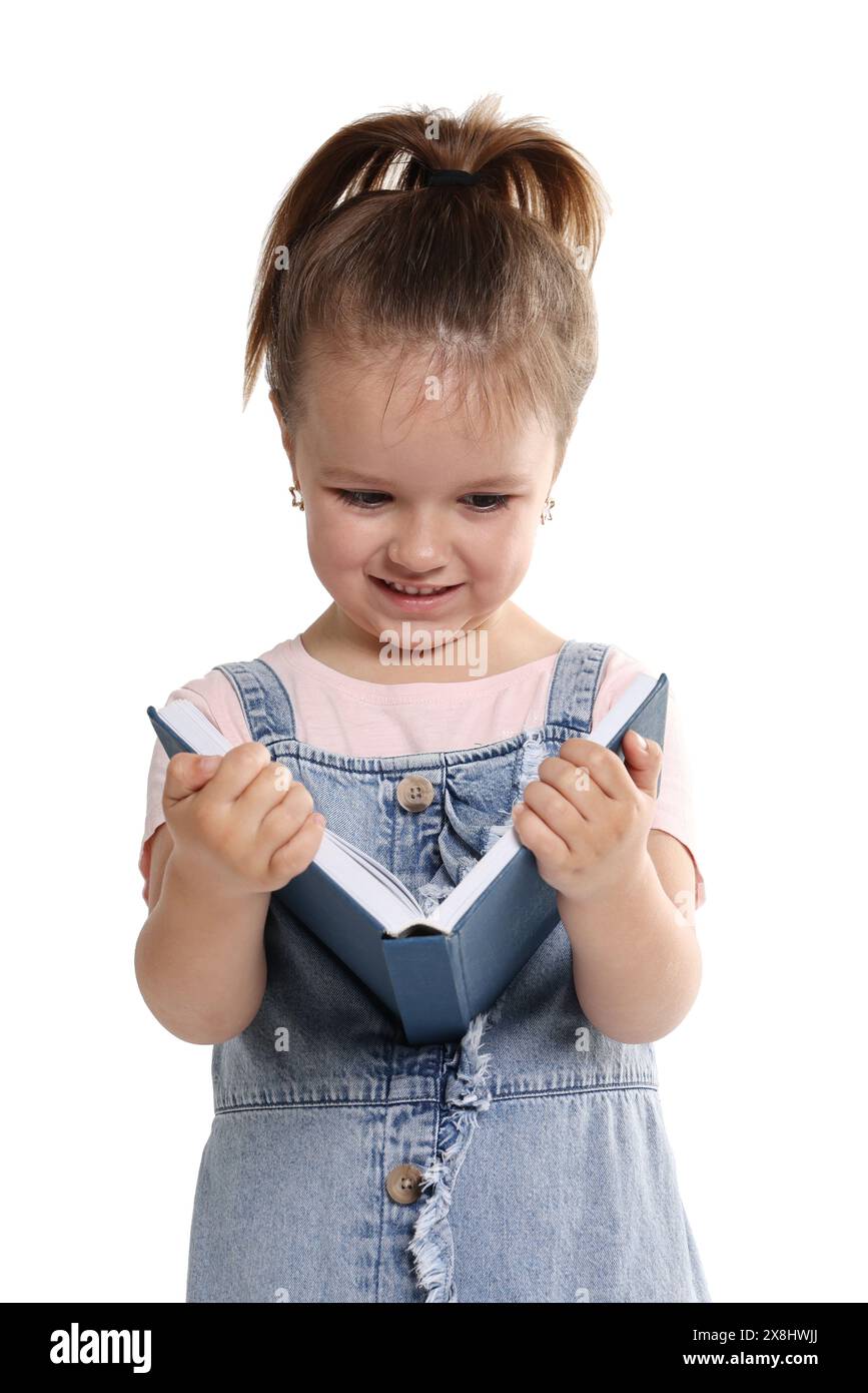 Cute little girl reading book on white background Stock Photo - Alamy