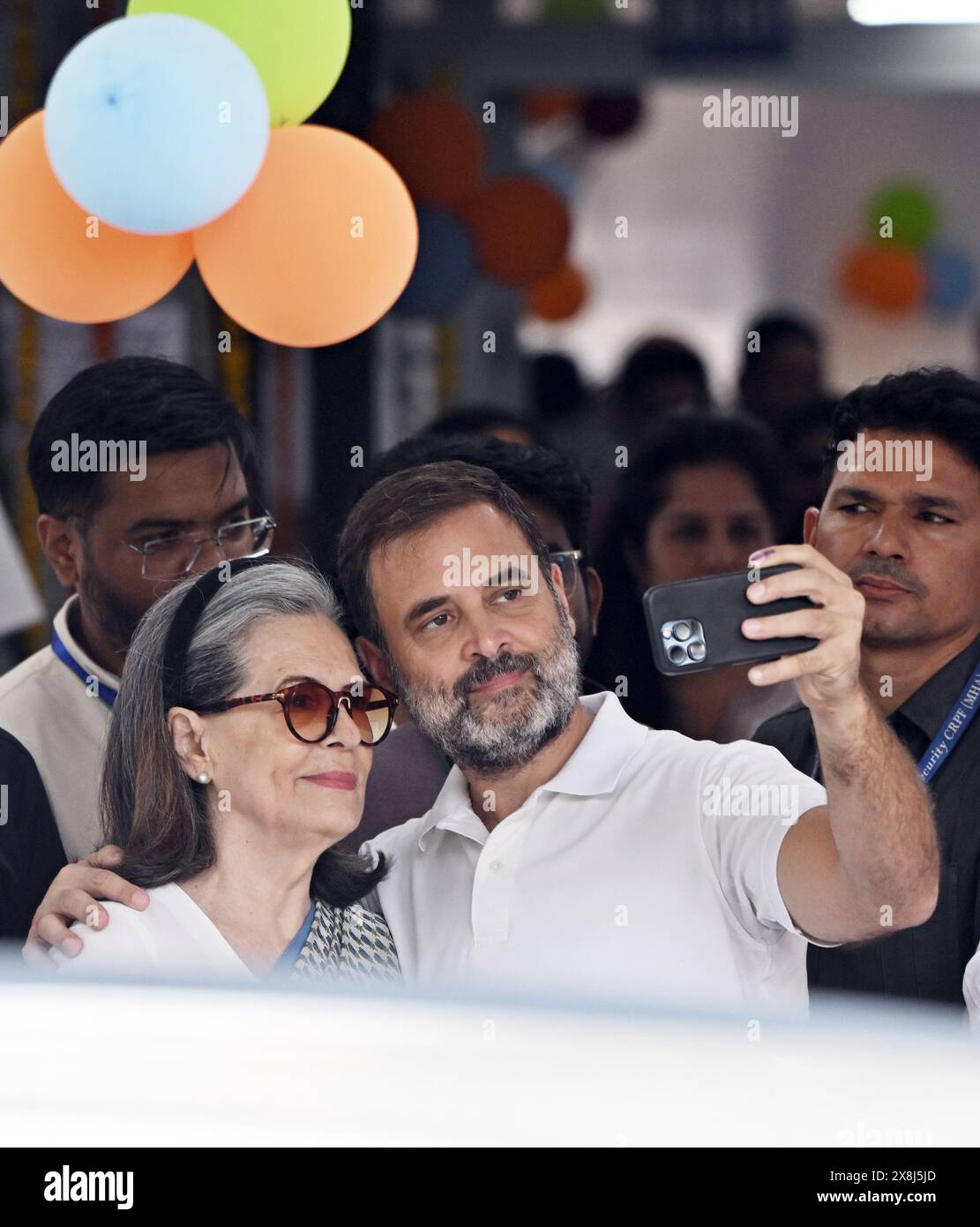 NEW DELHI, INDIA - MAY 25: Congress leader Rahul Gandhi clicks a selfie with his mother Sonia Gandhi after casting his vote at a polling booth during the sixth phase of Lok Sabha elections, on May 25, 2024 in New Delhi, India. Polling for the sixth phase of general elections concluded in 58 constituencies across six states and two Union territories, including all seven seats in Delhi. Voter turnout across six states and two Union Territories during Phase 6 polling has been recorded at approximately 58.84 per cent, according to the Voter Turnout App of the Election Commission. (Photo by Sanjeev Stock Photo