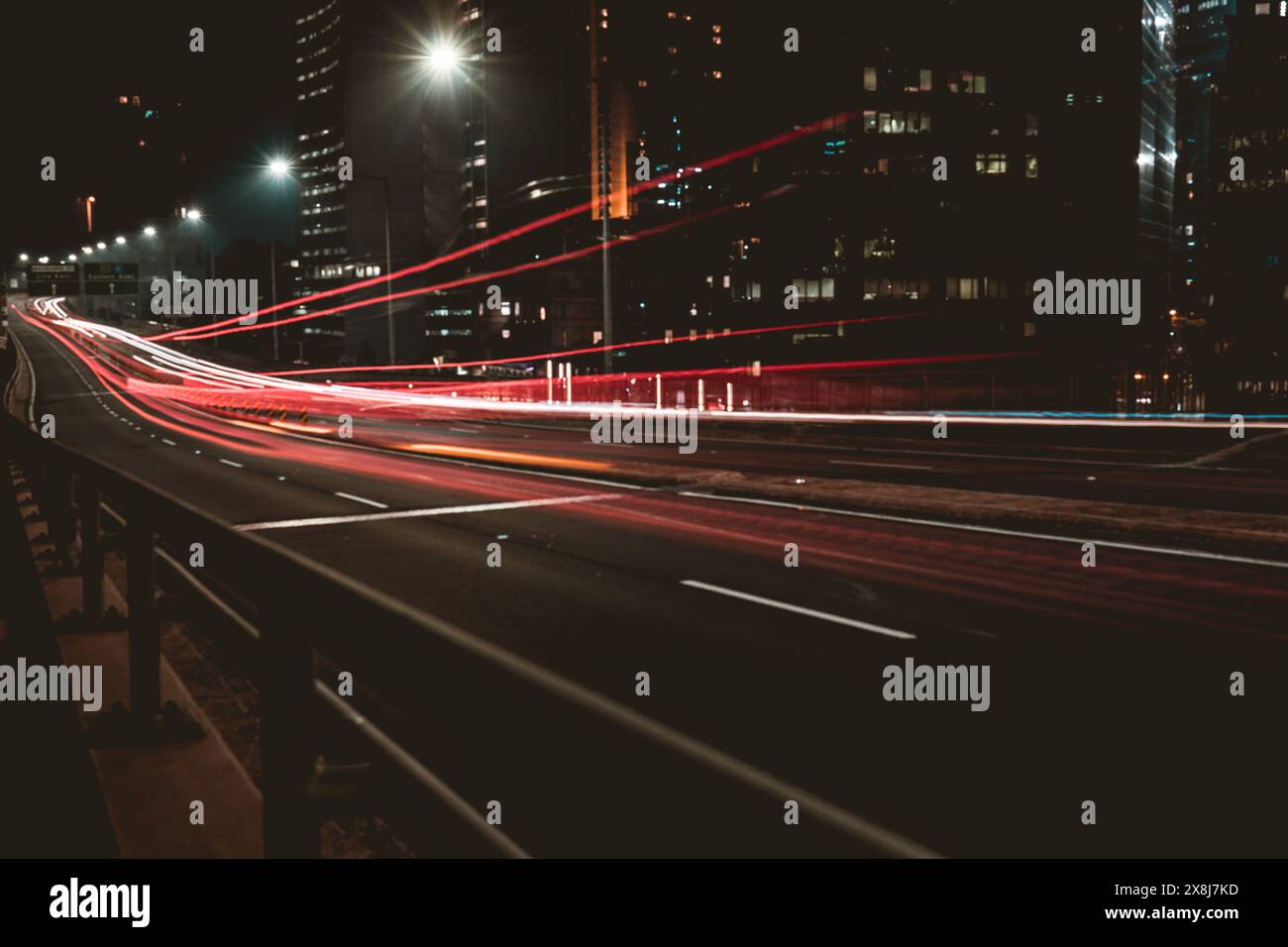 Light trails from cars going over the highway Stock Photo