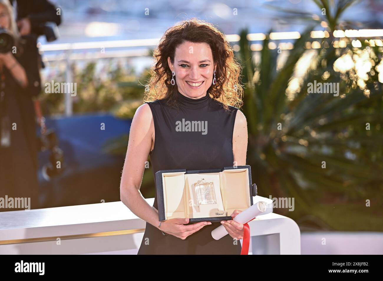 Coralie Fargeat poses with the 'Best Screenplay' award for 'The