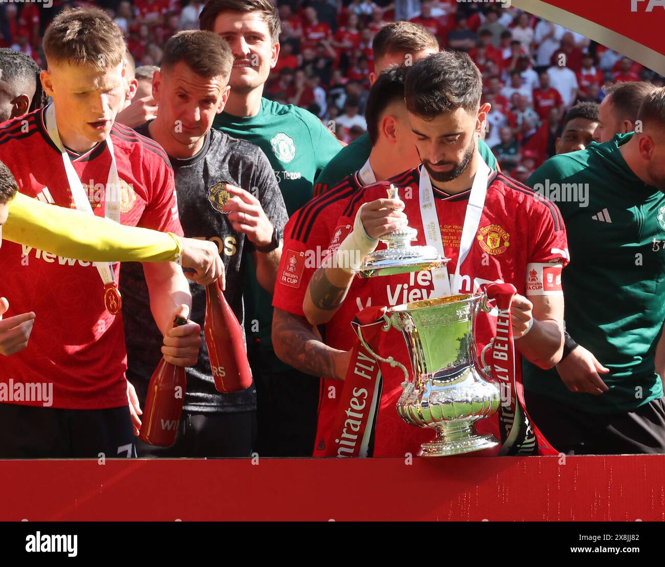 London, UK. 25th May, 2024. LONDON, ENGLAND - Manchester United's Bruno Fernandes looks at The FA Cup Trophy The FA Cup Trophy after The Emirates FA Cup Final soccer match between Manchester City and Manchester United at Wembley Stadium on 25th May, 2024 in London, England. Credit: Action Foto Sport/Alamy Live News Stock Photo