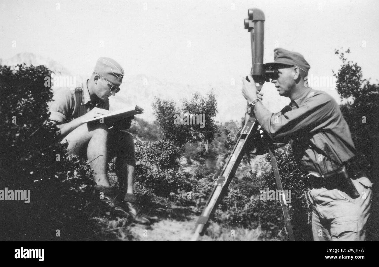 A german observation team at work in the mountains of Italy in tropical uniform. Scanned and enlarged from 9 x 6 cm private photograph. Stock Photo