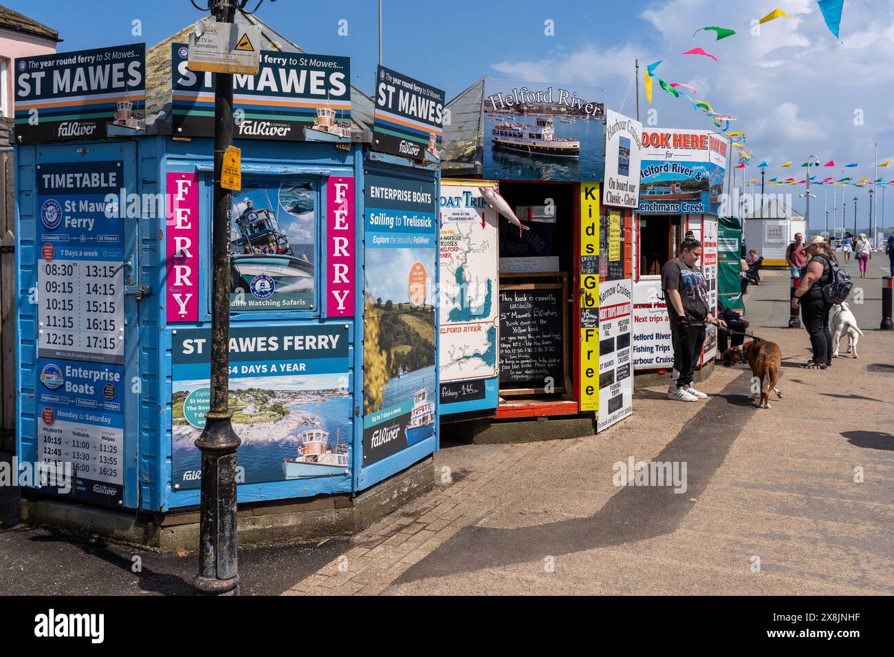 Boat trip kiosks at the entrance to the Prince of Wales pier, Falmouth, Cornwall Stock Photo