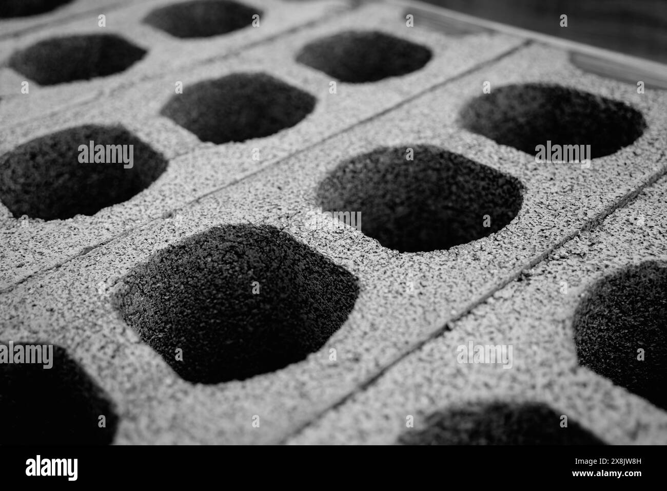 Concrete blocks with holes stacked on top of each other Stock Photo