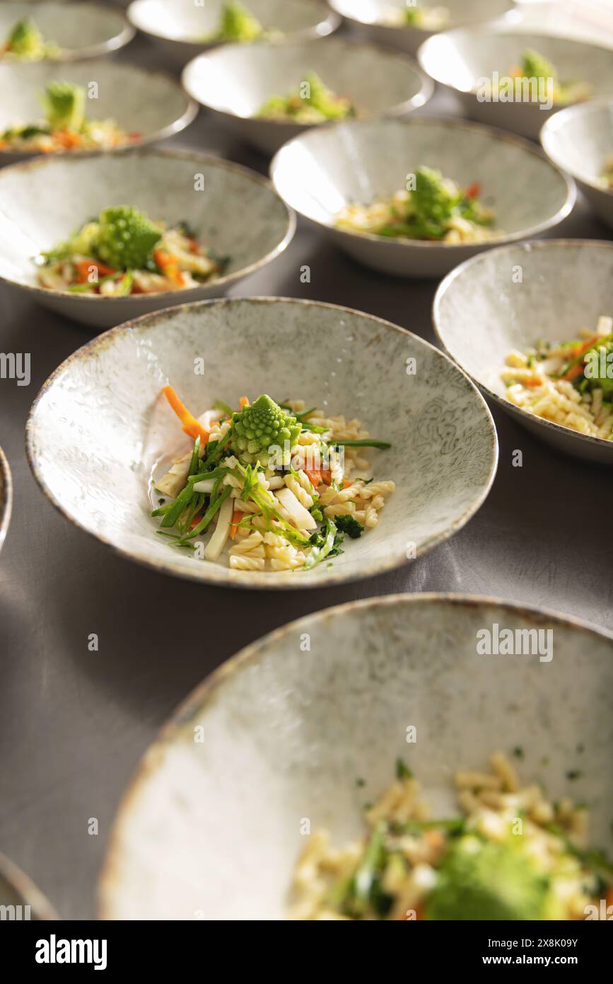 Gourmet vegetarian salad dishes in elegant setting Stock Photo