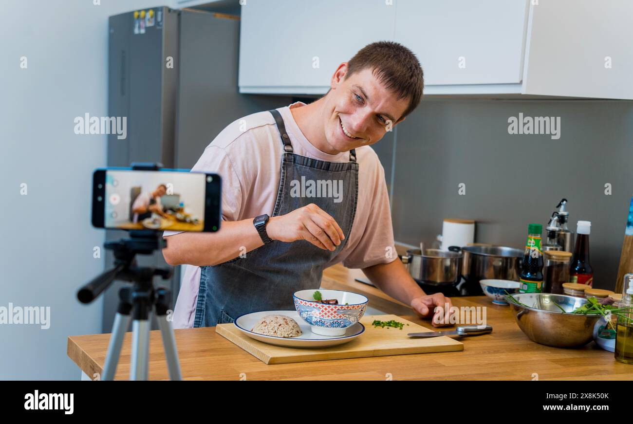 The chef is broadcasting live from workshop how to prepare a vegetarian massaman curry Stock Photo