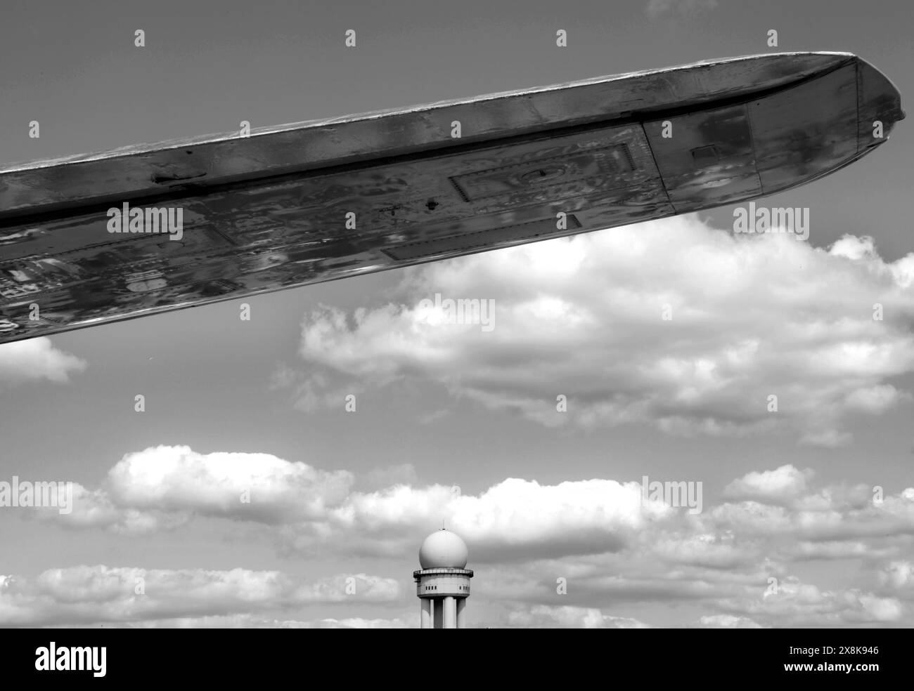 Clouds at Berlin Tempelhof Airport, wings of an aeroplane and a radar ...