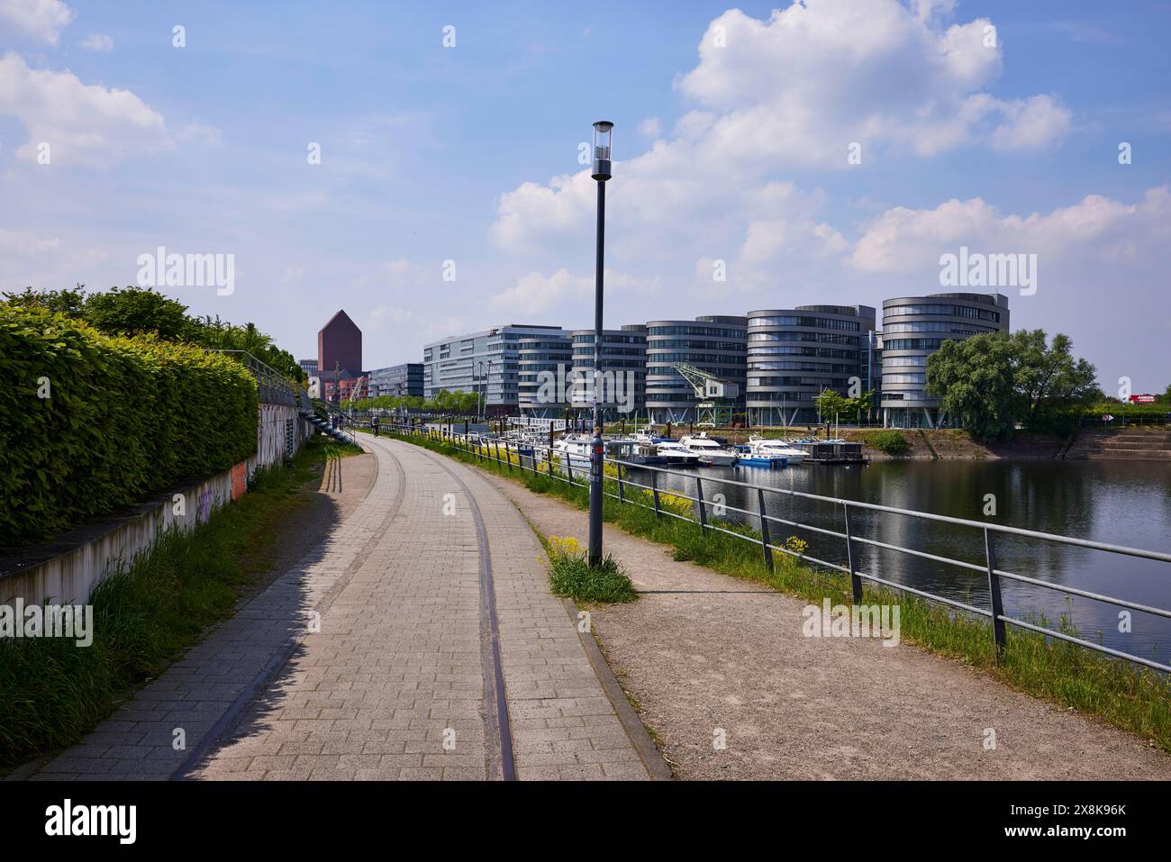 Five Boats office building by architect Sir Nicholas Grimshaw & Partners and the marina on Philosophenweg in the inner harbour of Duisburg, Ruhr Stock Photo