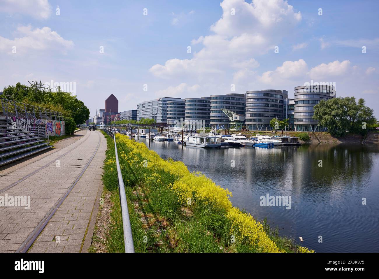 Five Boats office building by architect Sir Nicholas Grimshaw & Partners and the marina on Philosophenweg in the inner harbour of Duisburg, Ruhr Stock Photo