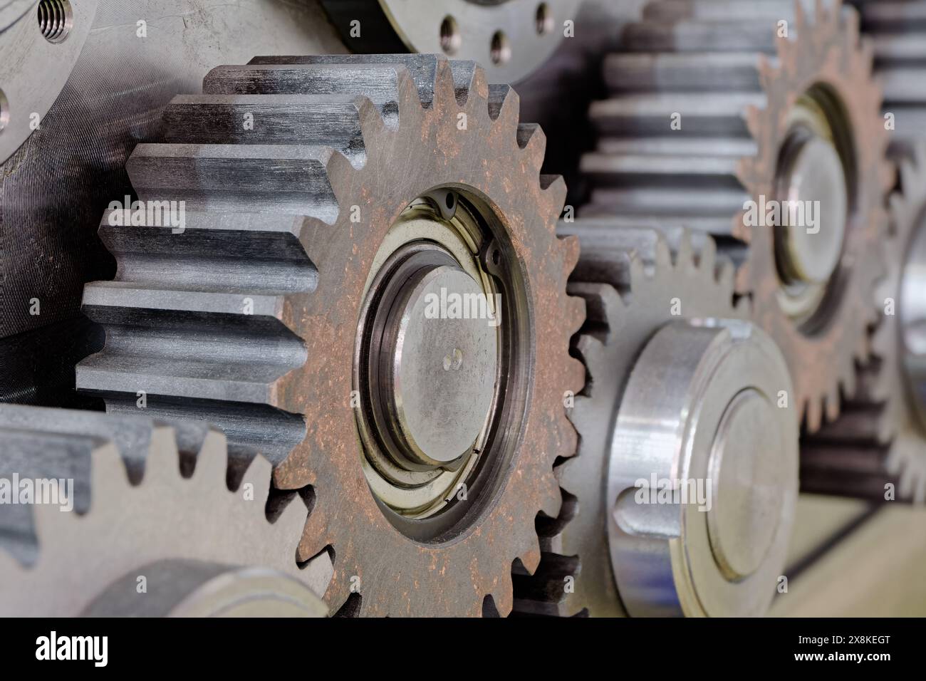 Group of pinions, part of gear box or servo mechanism, close up shot, machinery background Stock Photo