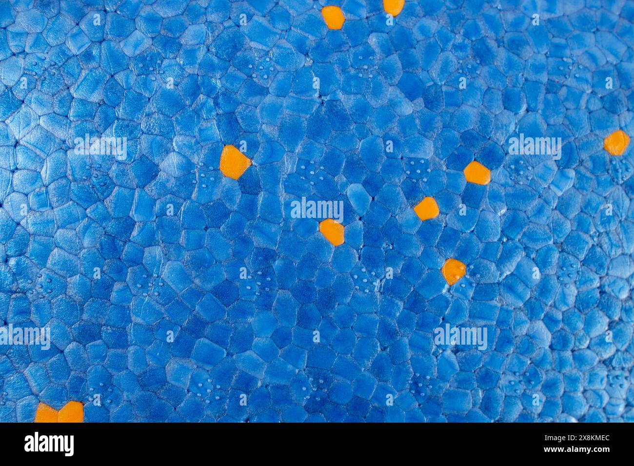 Blue styrofoam structure with orange dots, abstract textured pattern ...