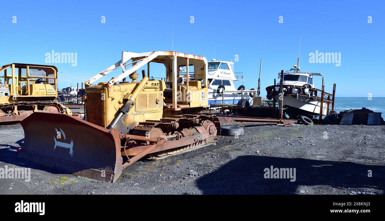 Pirinoa, New Zealand - 05-05-24:Vinatge CAT D5B excavator and boat ...