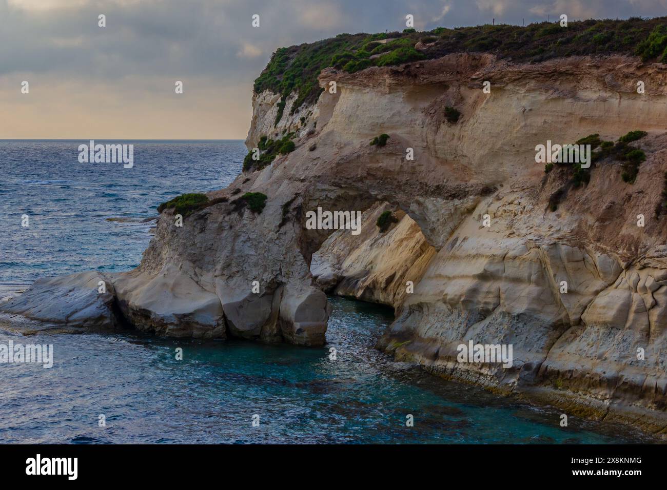 Tranquil coastline with stunning rock formations and crystal clear water. Stock Photo