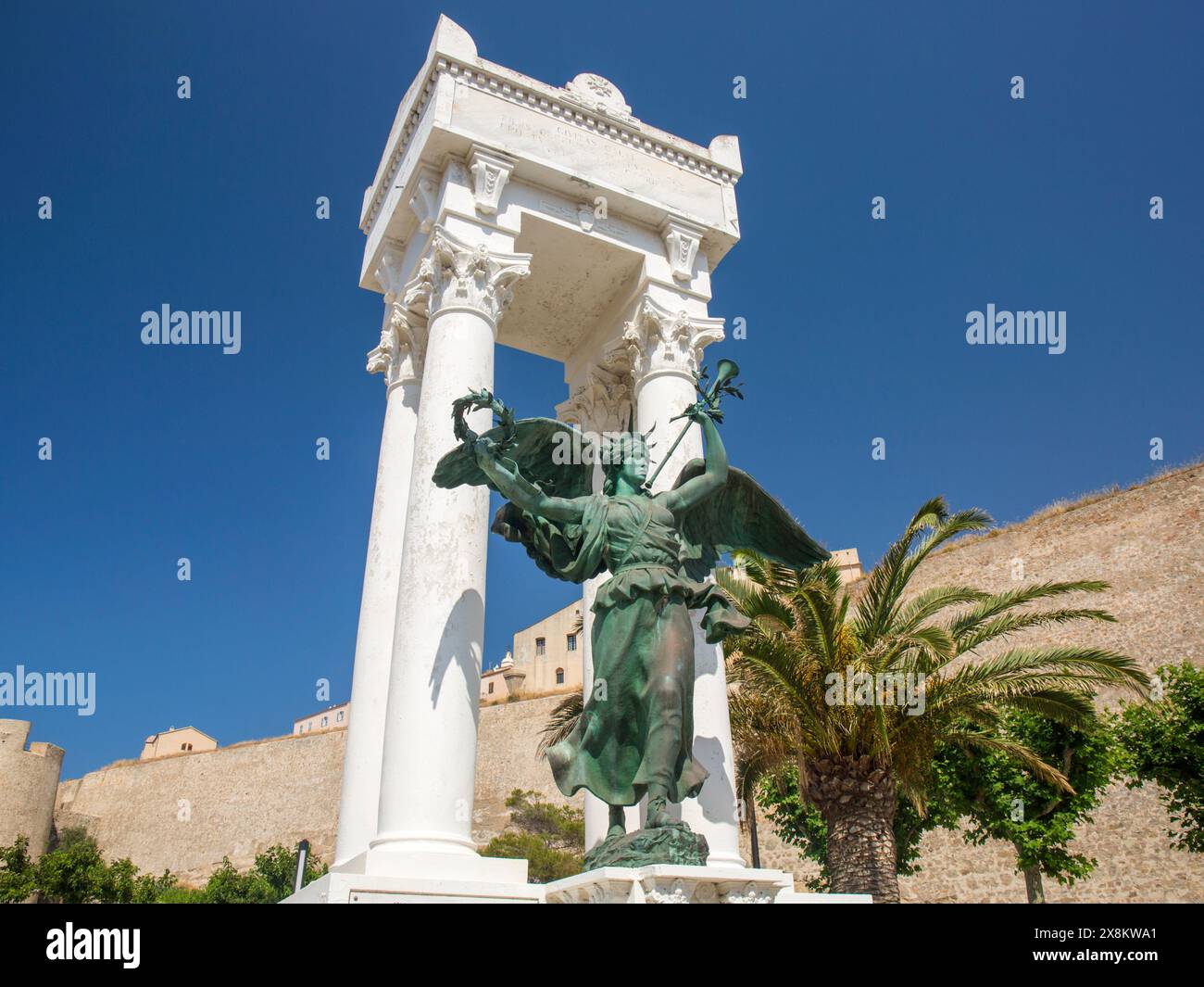 Calvi, Haute-Corse, Corsica, France. The Monument aux Morts in Place Christophe Colomb, an ornate war memorial depicting Marianne, symbol of France. Stock Photo