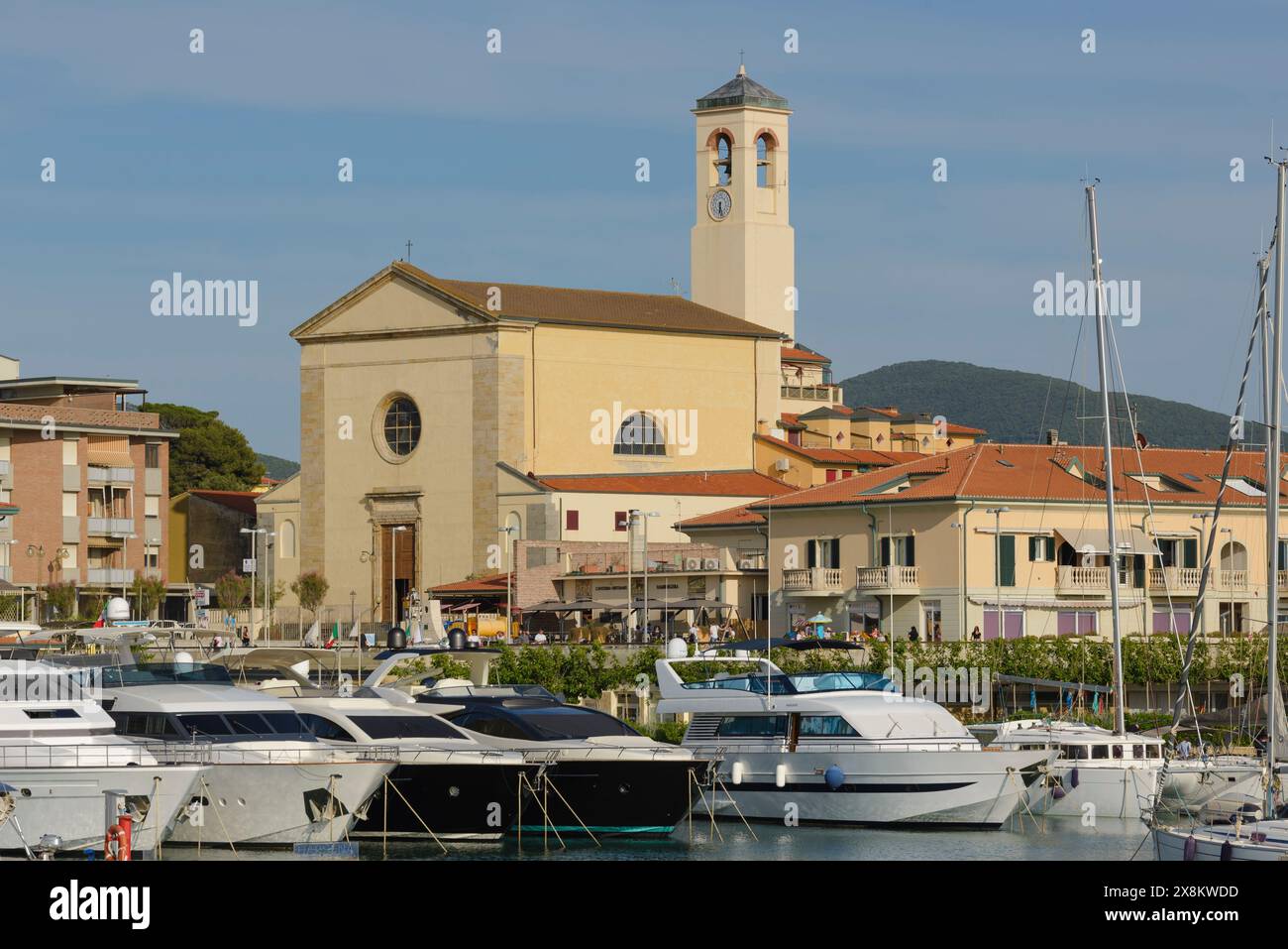 View Of The Tourist Port Of San Vincenzo With Moored Sailing Boats And view-of-the-tourist-port-of-san-vincenzo-with-moored-sailing-boats-and