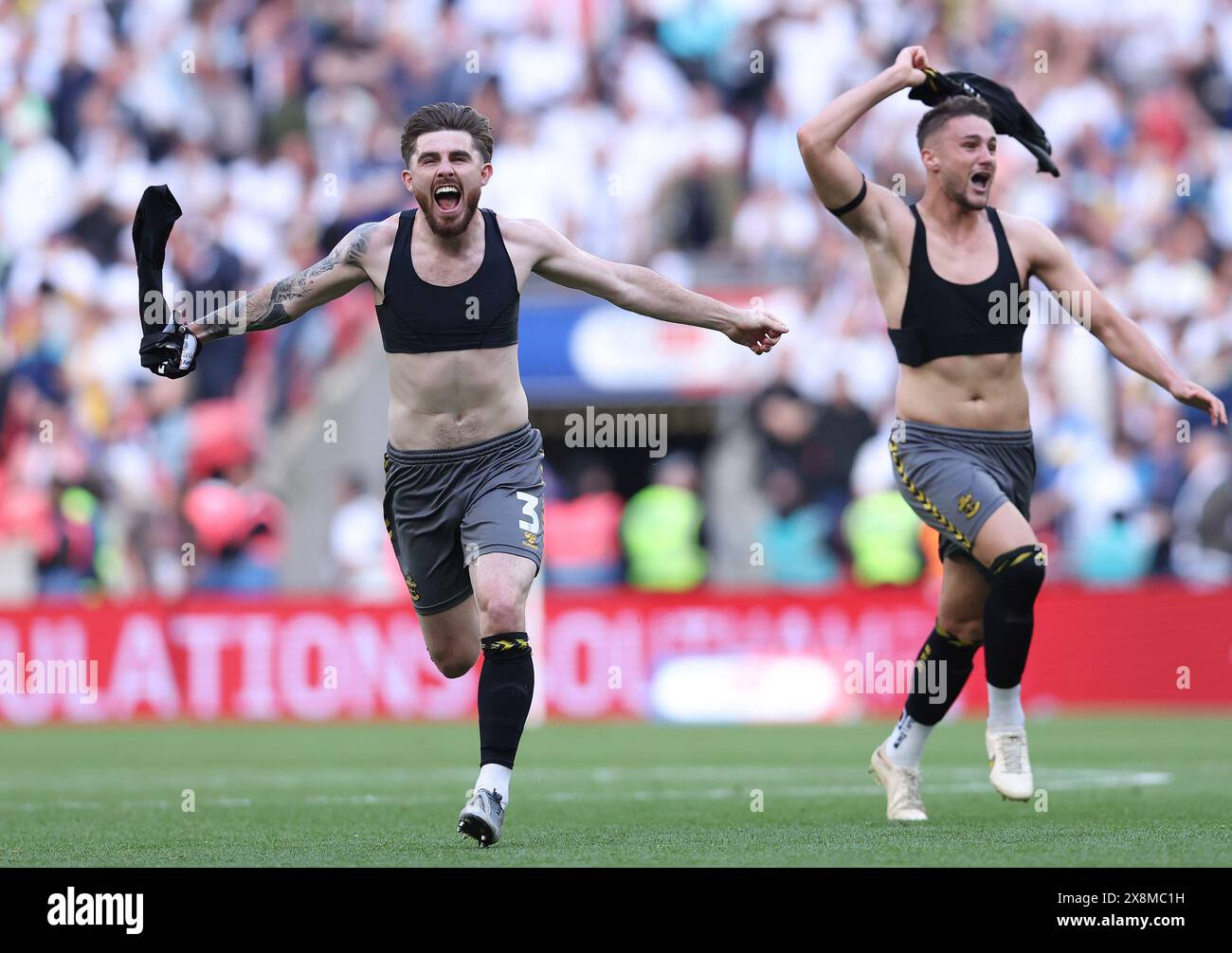 London, UK. 26th May, 2024. Ryan Manning (L) and Taylor Harwood-Bellis of Southampton celebrate after the Sky Bet Championship match at Wembley Stadium, London. Picture credit should read: Paul Terry/Sportimage Credit: Sportimage Ltd/Alamy Live News Stock Photo
