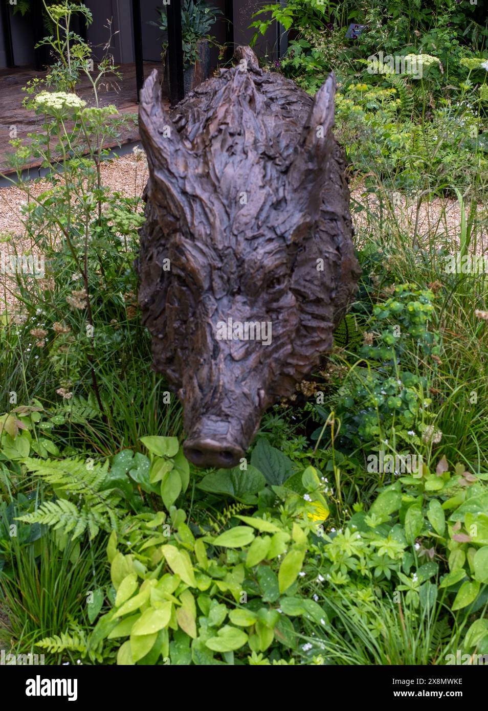 Boar statue in the green grass on display for sale at the 2024 RHS ...