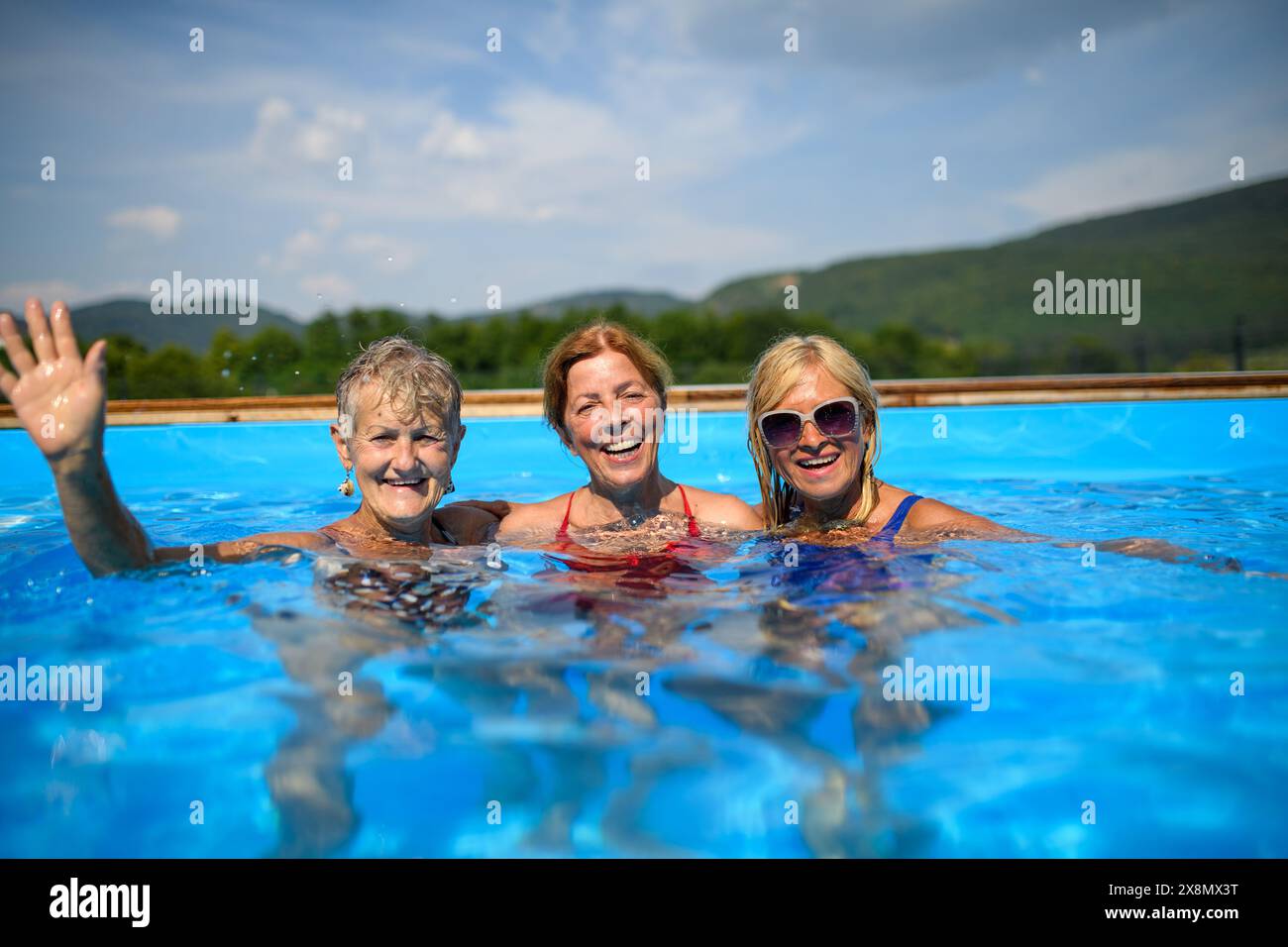 Senior Pool Fun Playful elderly man jumping hi-res stock photography and images - Alamy
