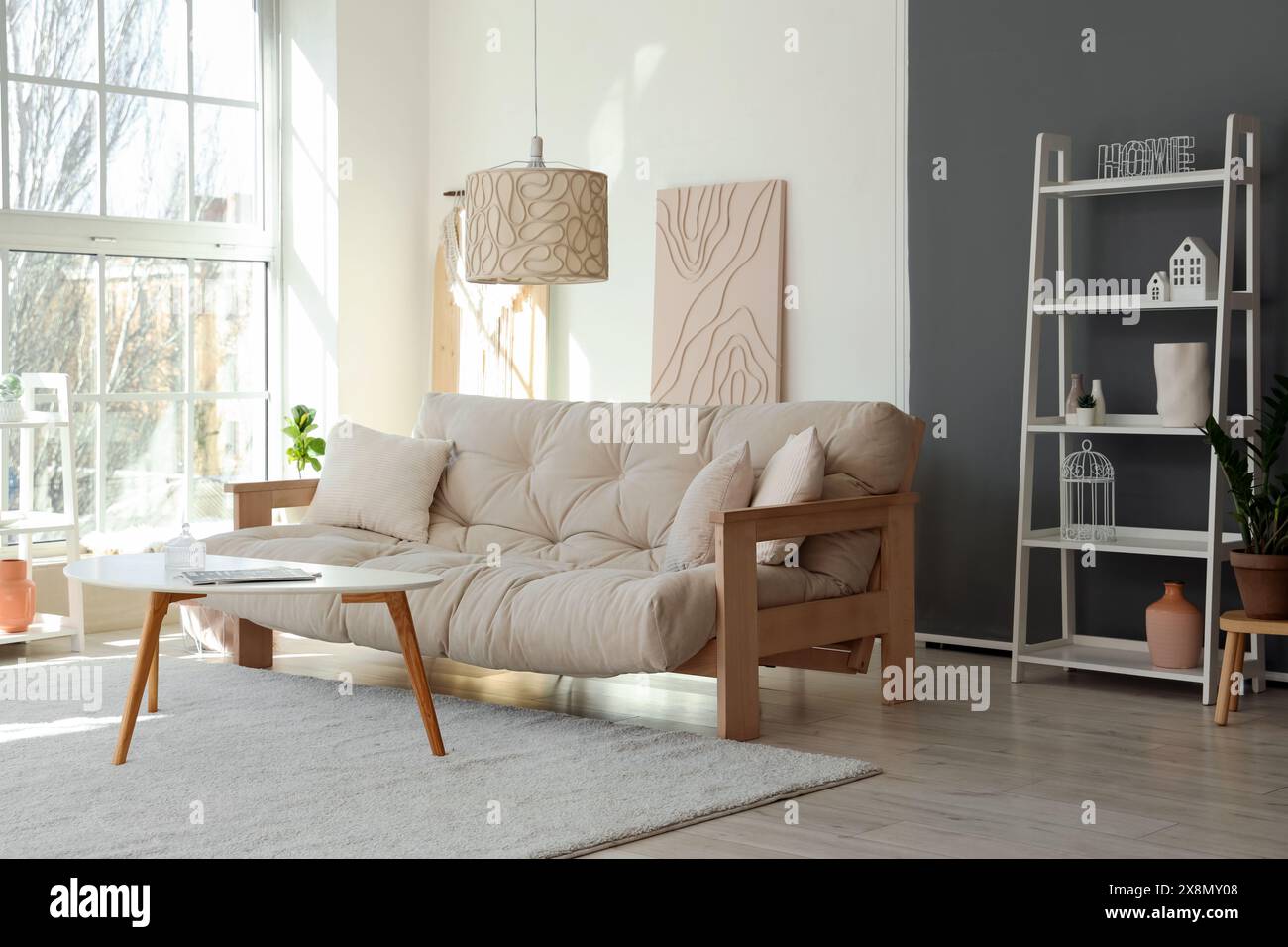 Light interior of modern living room with comfy sofa, coffee table and ...