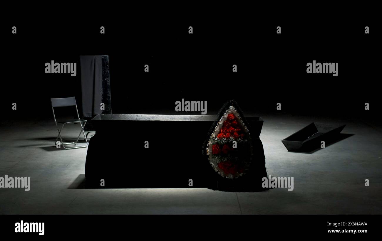 Coffin on stage. Stock footage. Dark scene with empty coffin and
