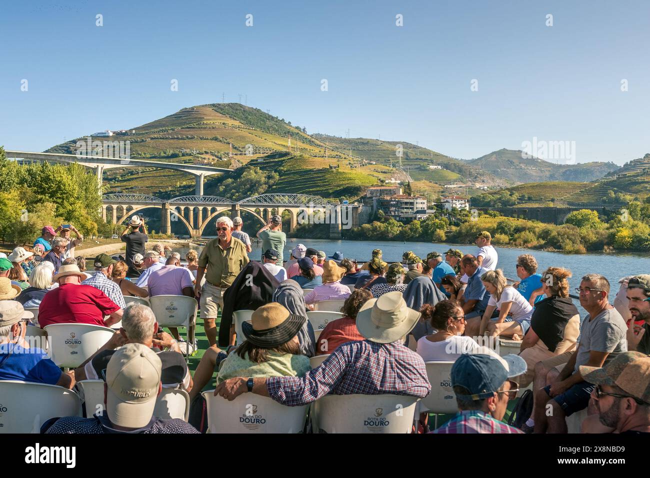 Peso da Régua, Portugal - October 05, 2023: Passengers on the deck of a cruise boat on the Douro River from Peso da Régua, Portugal. Stock Photo