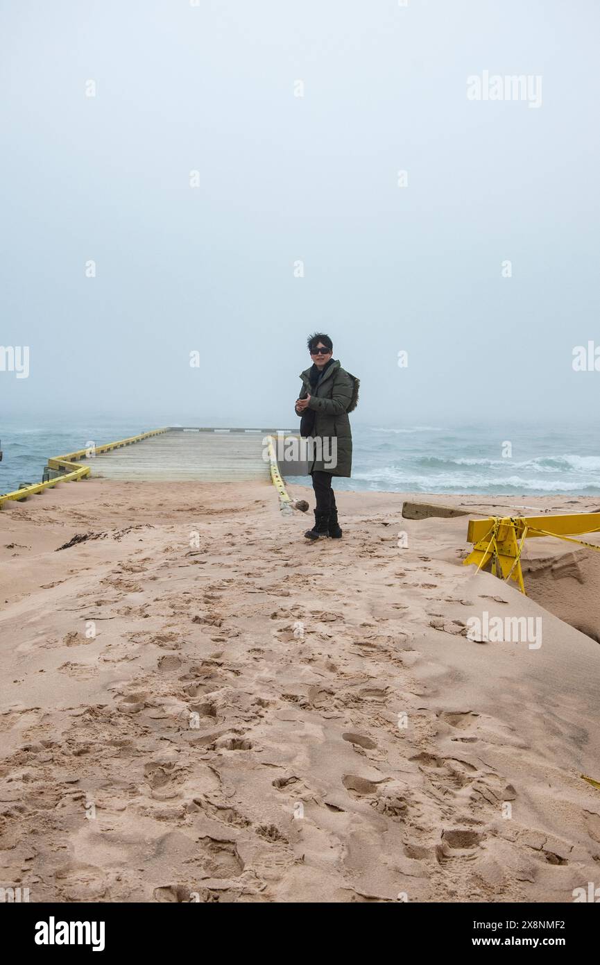 Large accumulation of drifting sand from the winter on the boardwalk at ...