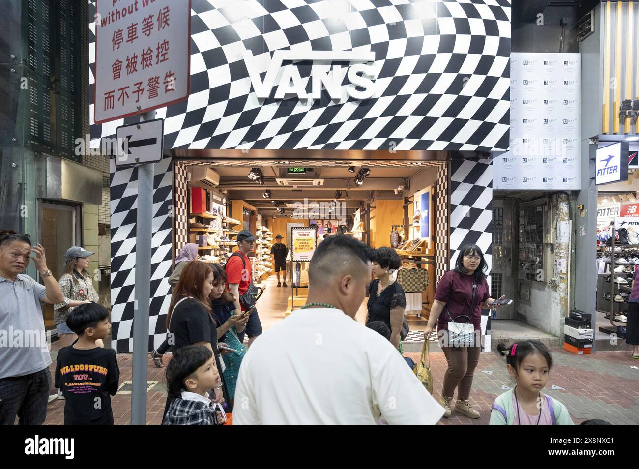 Hong Kong, China. 1st May, 2024. Pedestrians and shoppers are seen outside the American multinational sports clothing brand owned by VF Corporation, Vans, store in Hong Kong. (Credit Image: © Sebastian Ng/SOPA Images via ZUMA Press Wire) EDITORIAL USAGE ONLY! Not for Commercial USAGE! Stock Photo