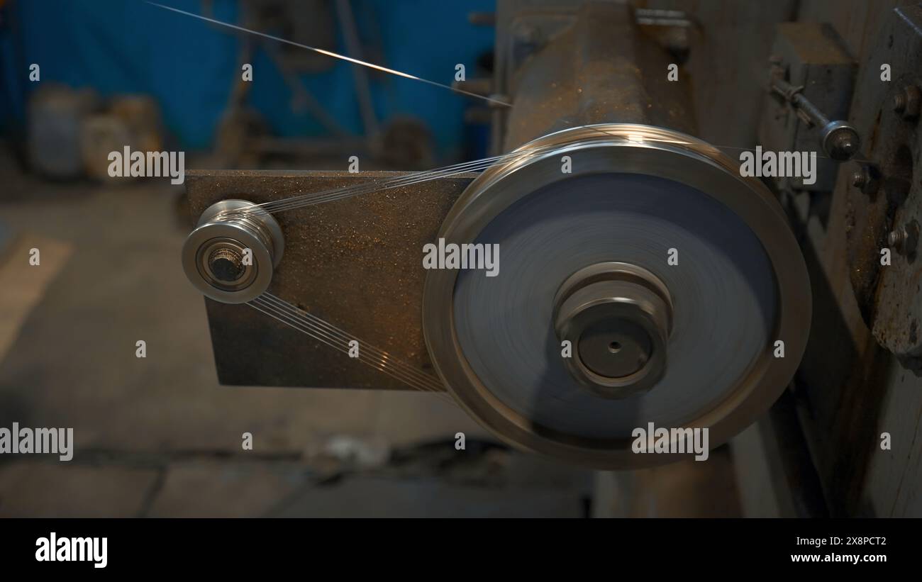 Industrial Rotating Machine with wire. Creative. Rotating coils winding ...