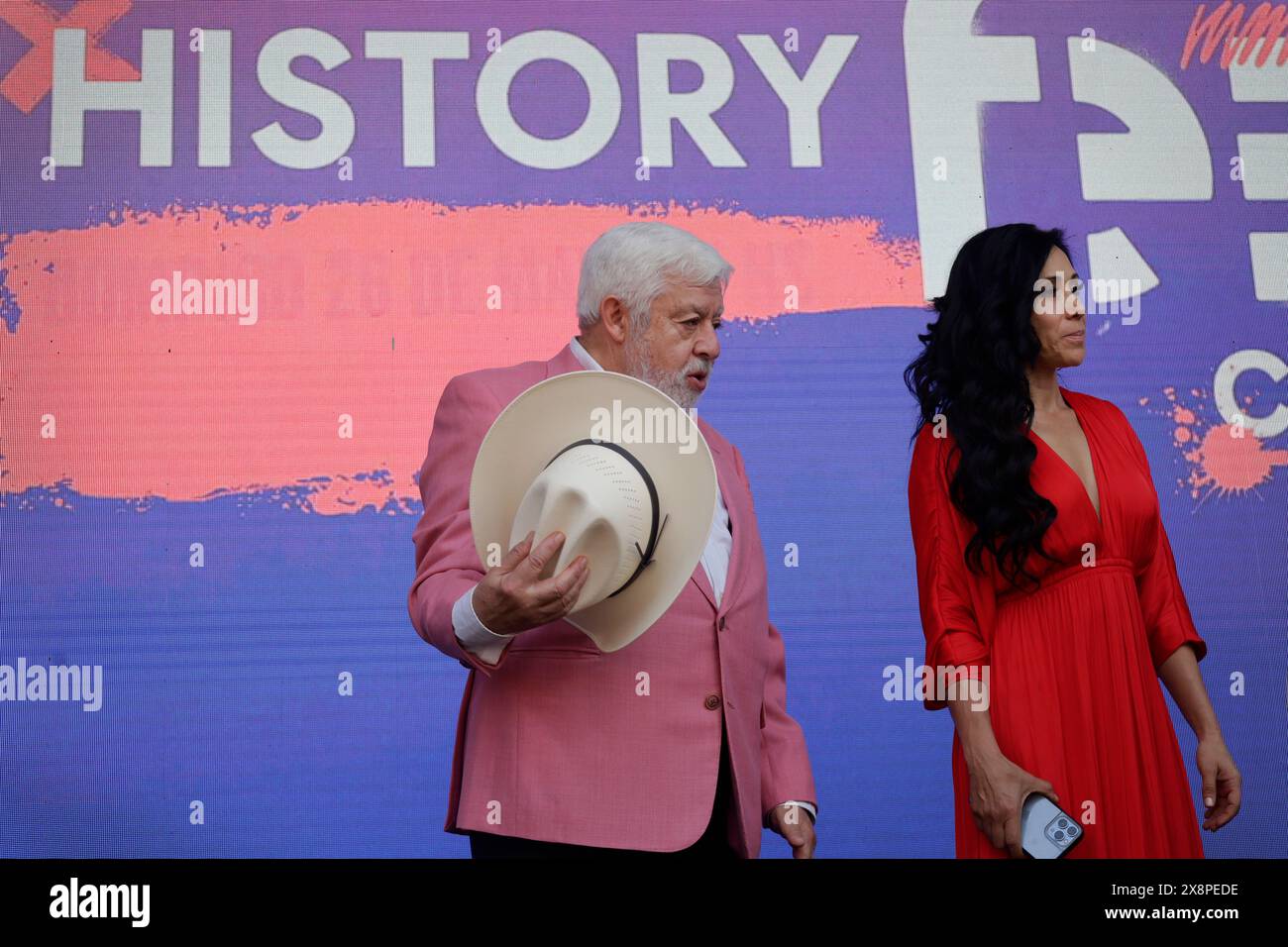 Mexico City, Mexico. 26th May, 2024. Jaime Maussan, UFO researcher, is putting on a hat during a talk at the Papalote Museo del Nino in Mexico City, Mexico, on the occasion of the History Fest event, which is featuring simultaneous activations of El Escenario Principal, Historia Manana, Cine de Historia, and Foro de Historia, as well as entertainment areas such as Historia Kids, Historia Travel, and Historia Extrema. (Photo by Gerardo Vieyra/NurPhoto) Credit: NurPhoto SRL/Alamy Live News Stock Photo