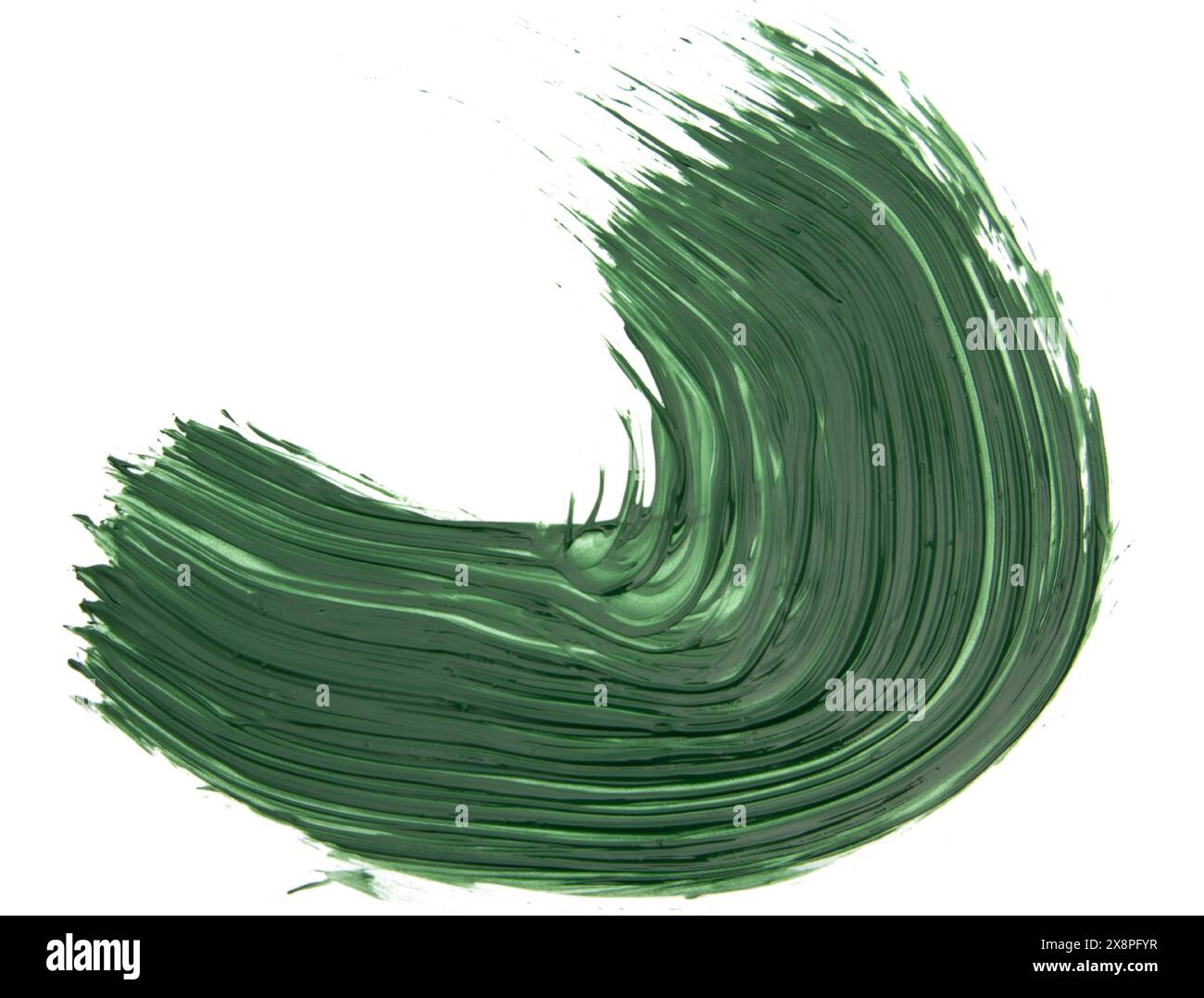 Dynamic swipe of green paint creates an artistic, curved brushstroke Stock Photo