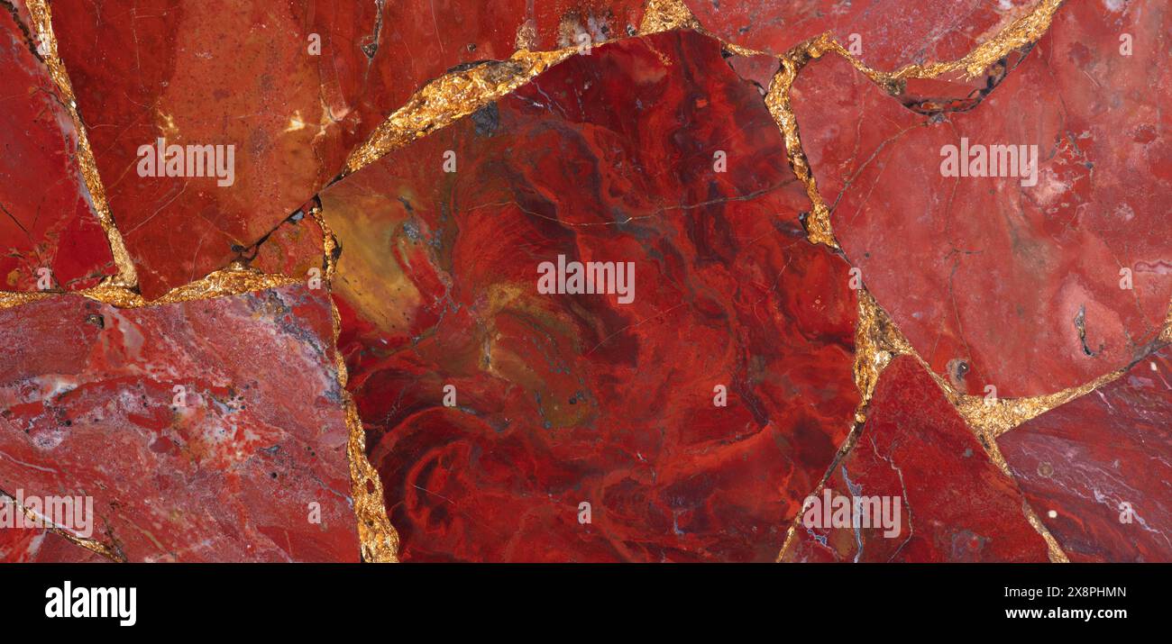 Expensive stone red jasper texture with a gold leaf. Stock Photo