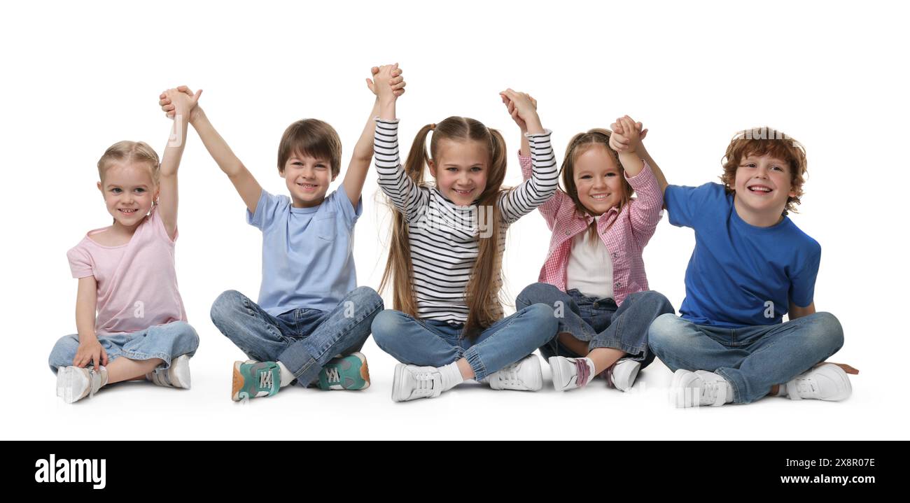 Group of cute children holding hands on white background Stock Photo ...