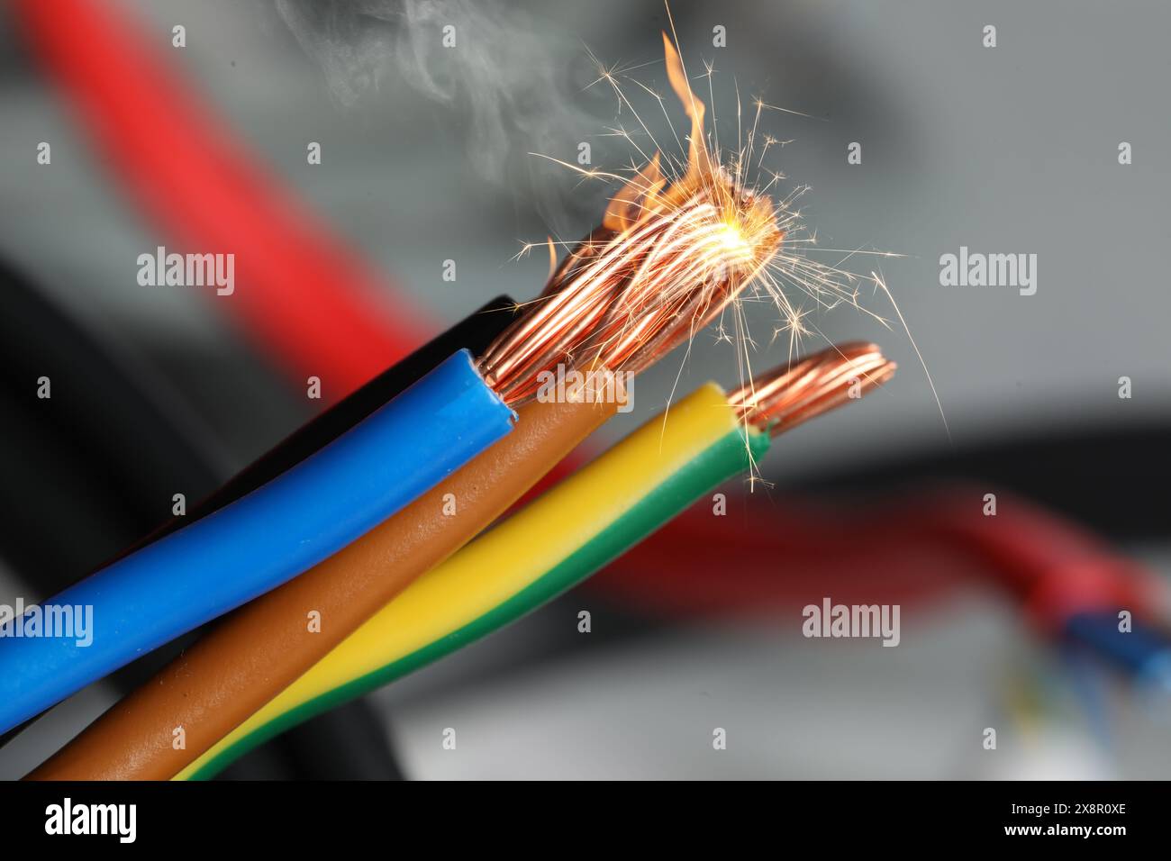 Sparking wiring on blurred background, closeup view Stock Photo