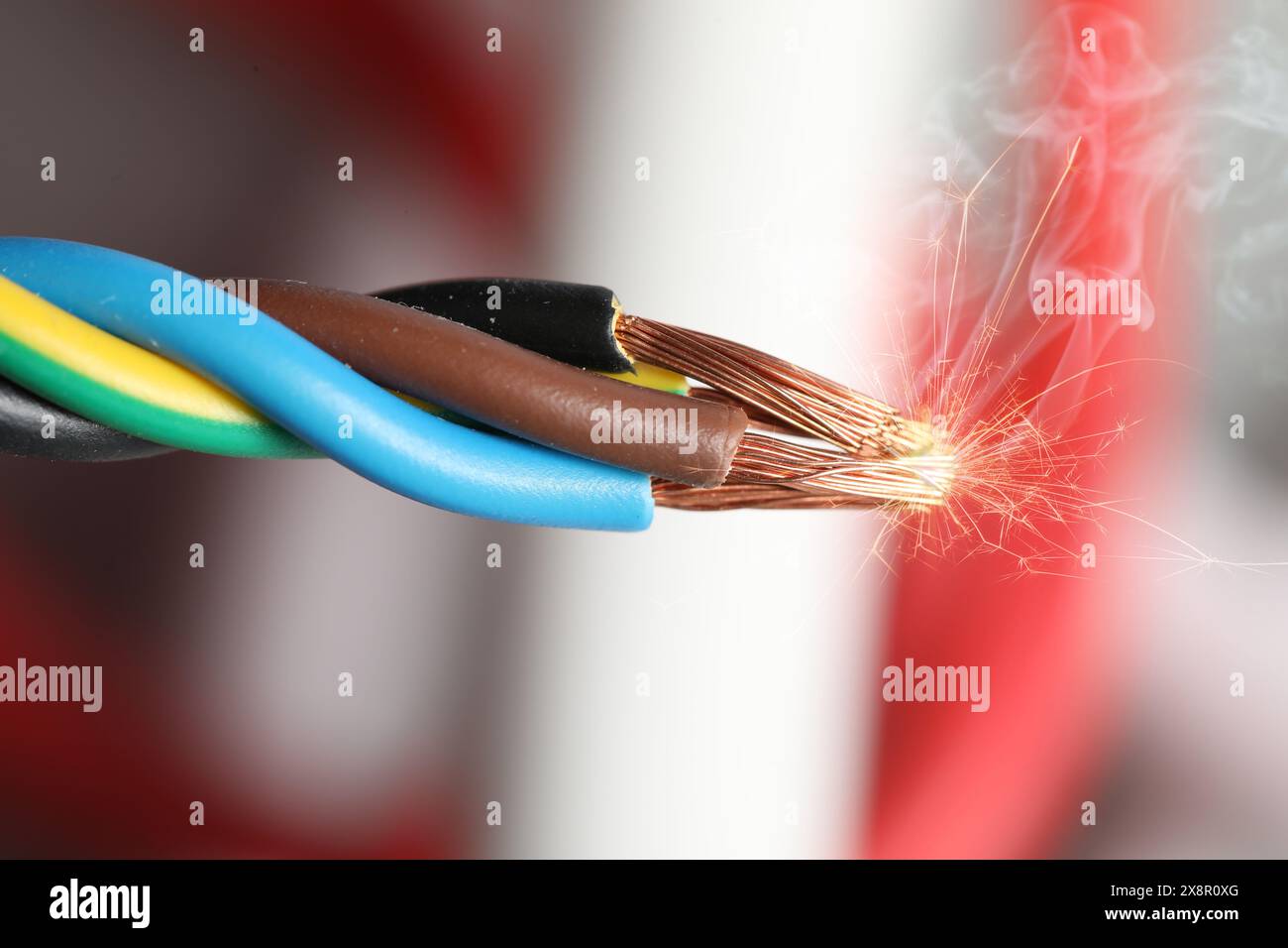 Sparking wiring on blurred background, closeup view Stock Photo