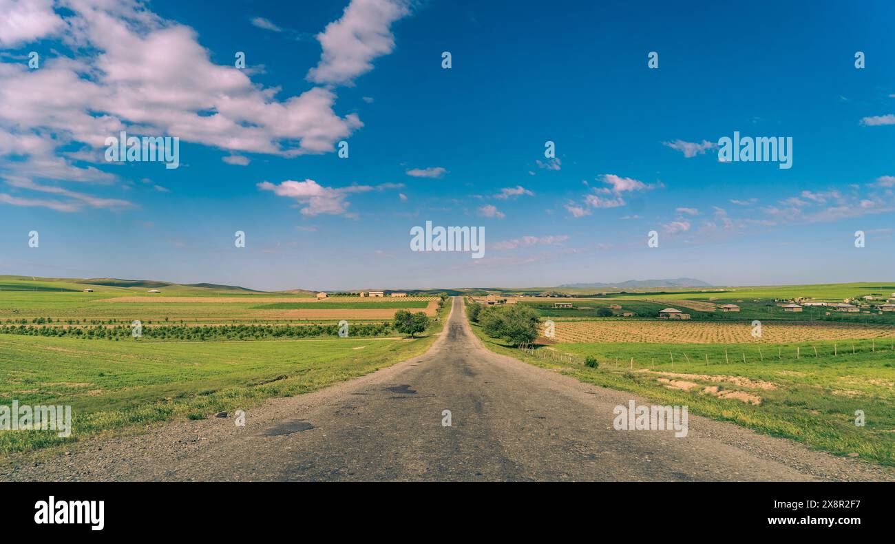 Blue sky green land road hi-res stock photography and images - Alamy