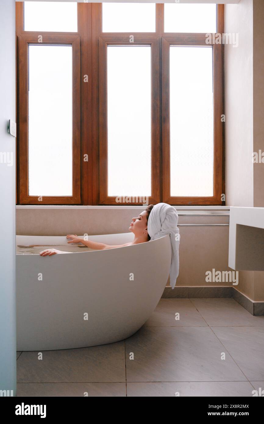 Woman relaxing in bath hi-res stock photography and images - Alamy