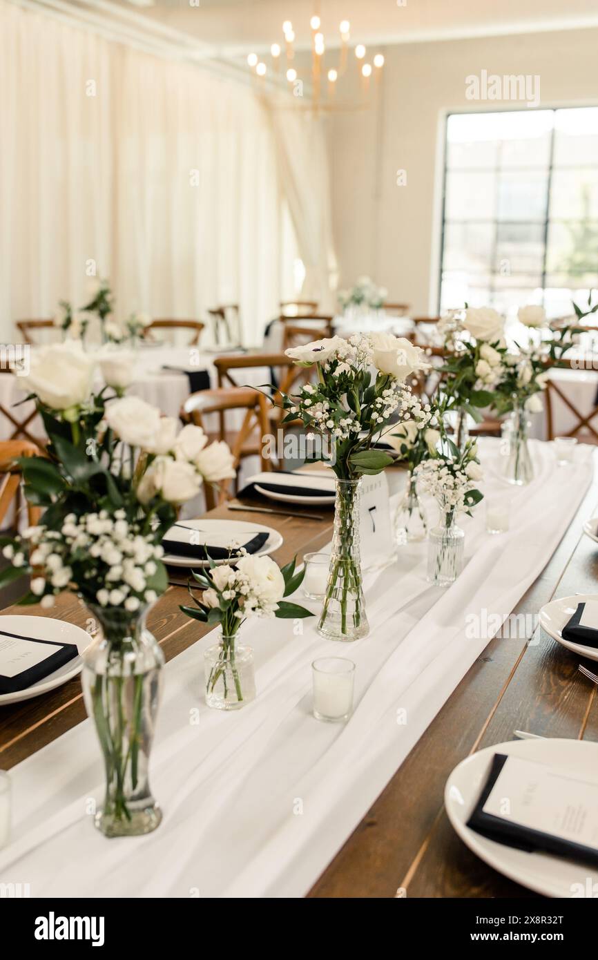 Elegant table setting with white floral decor Stock Photo